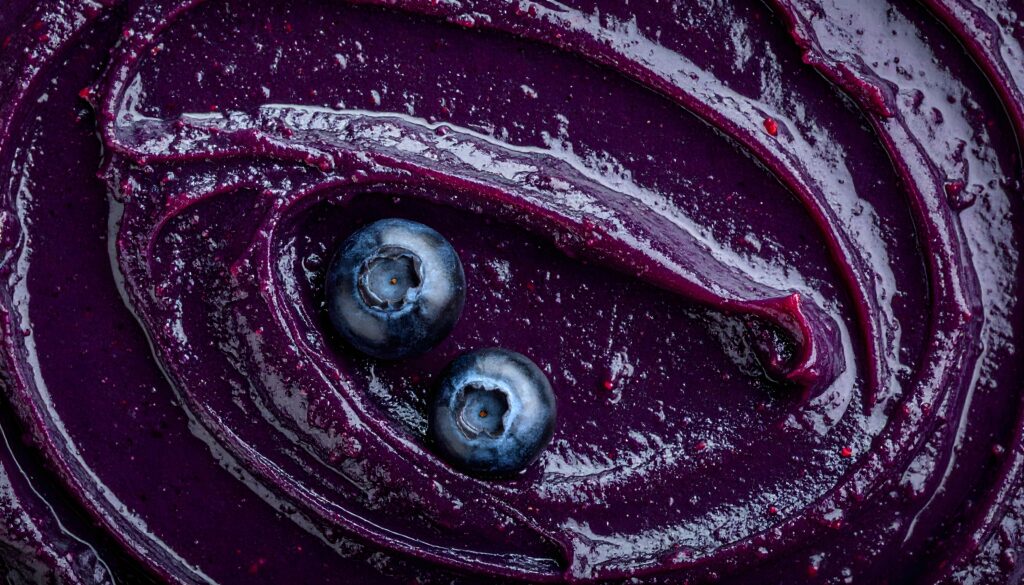 Thick blueberry puree showing a smooth, viscous texture