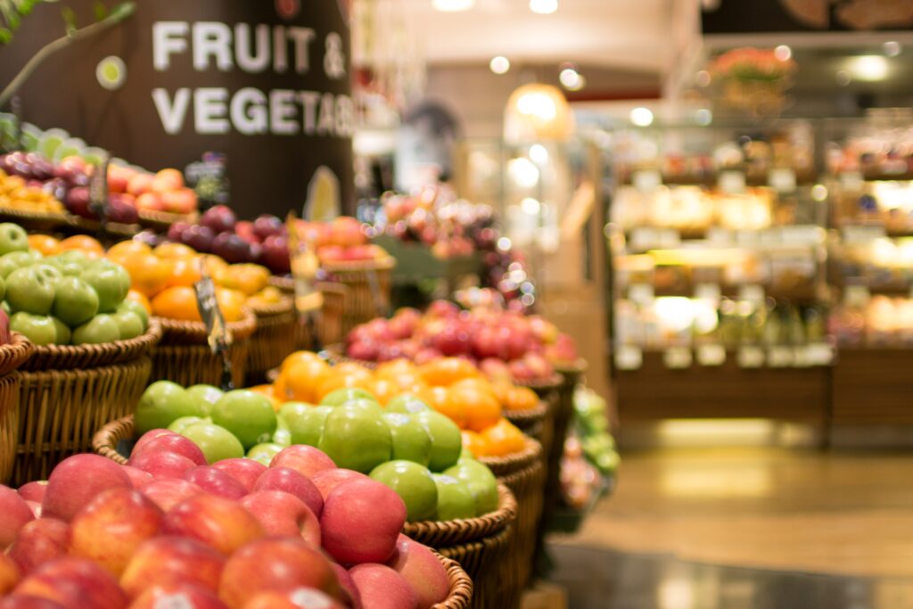 Apples and other fresh produce displayed for sale at a fruit market